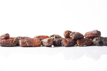 Date fruits on white background. Selective focus.