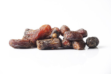 Date fruits on white background. Selective focus.
