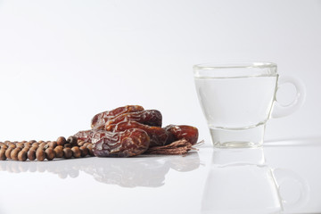 A dates and glass of water - the things used to break the fast at sunset during the Muslim holy month of Ramadan