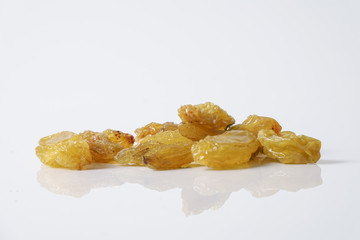 Dates and raisin isolated on white.