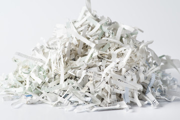 Pile of shredded paper on white background
