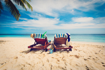 Two beach chairs on tropical vacation