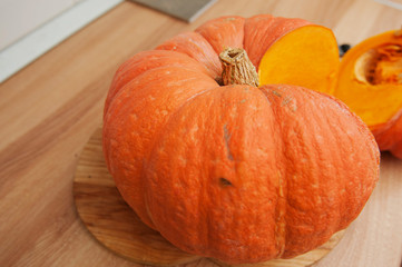A man cuts a ripe, beautiful, juicy pumpkin!