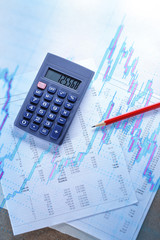 Operating budget, calculator and pencil