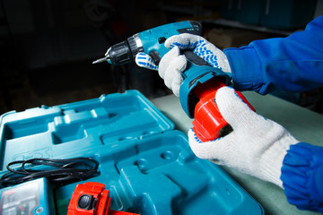 Male hand holding a screwdriver