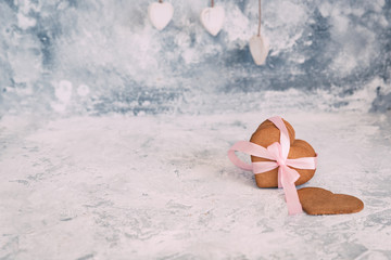 Hearts shaped cookies over vintage background. Copy space