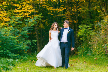 Elegant curly bride and stylish groom