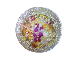 Top view of aluminum bowl isolated with  jasmines and orchids float on a water for Songkran aka Thai New Year's festival in Thailand