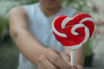 Red hart shape candy .