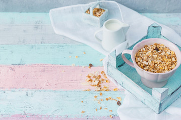 Muesli in bowl over wooden background. Healthy food