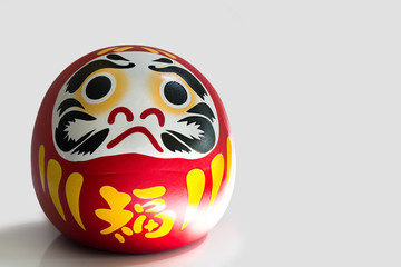 Daruma lucky doll Good luck new year of japanese on gray background