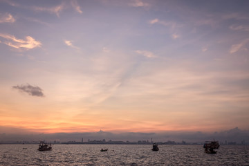 sunrise sky on sea with fisherman boat