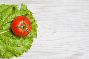 Fresh cherry tomatoes on wooden white background. Tasty diet product.