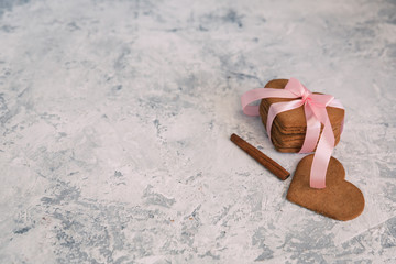 Hearts shaped cookies over vintage background with copy space