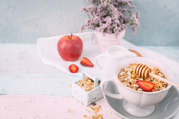 Oat flakes in bowl and fruits