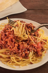 Plate of pasta with meat and tomato sauce