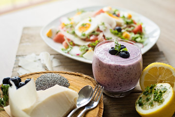 Chia blueberries smoothie and fresh salad, healthy eating concept