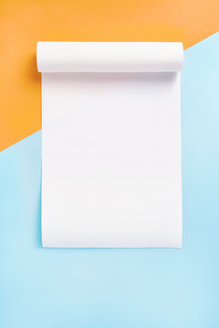 Stationary mock up on blue and orange background. Blank fax paper