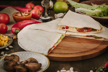 Nice vegetarian quesadilla with tortilla bread, beans, cheese and vegetables.