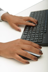 hands of a young african woman using a computer