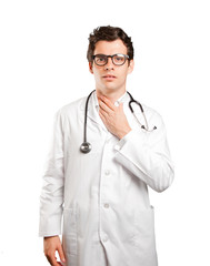 Fototapeta premium Stressed doctor against white background