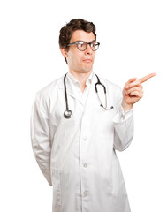Surprised doctor pointing against white background