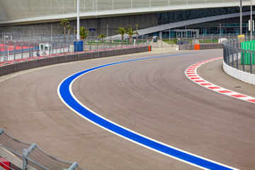 Motor racing track. Turning asphalt road with marking lines - obrazy, fototapety, plakaty
