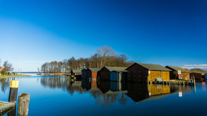 boat houses and calm river