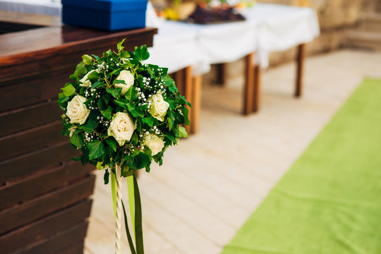 Flower compositions at the wedding ceremony. Wedding in Montenegro by the sea.
