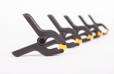 Obraz premium Clothespin. Carpentry clamps. Plasmic clothespin on a white background.
