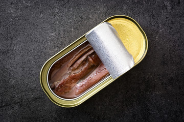 Anchovies can on slate background

