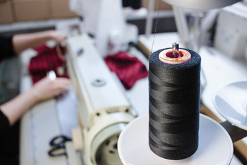 tailor working on sewing machine. Hands. close up. Tailoring. Details.