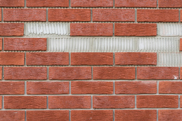 Obraz premium Brick wall with missing parts.