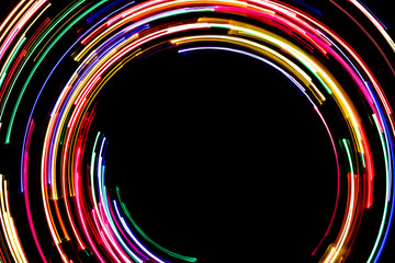 Abstract rotating neon lights texture with black empty copy space inside.
