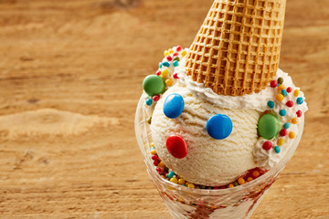 Fun clown ice-cream sundae with candy face