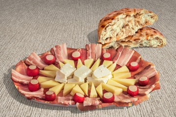 Appetizer Savory Dish Meze and Torn Pitta Bread Loaf Halves Set on Striped Brown Kraft Paper Background