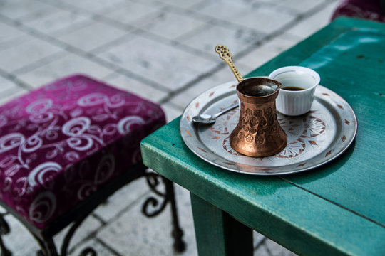 Traditional copper pot and cup of coffee in tavern in Sarajevo
