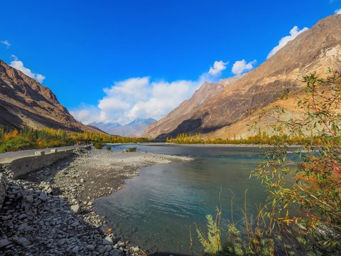 Autumn Landscape Of Ghizer River Along Hindu Kush Mountain Range In Ghizer Valley, Northern Pakistan