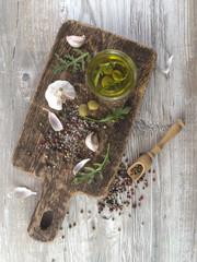 olive oil with olives on a wooden board. 