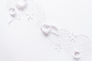 laser cutting, floral composition with white paper flower on white background