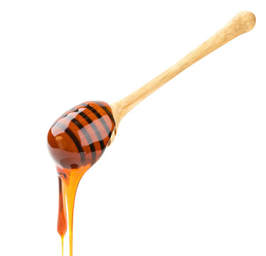 Isolated honey. Wooden honey stick isolated on white background with clipping path