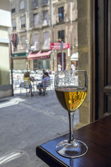 Glass of beer on a table in a bar typical of the City of Ubeda, Patrimony of the Humanity, Andalucia, Spain