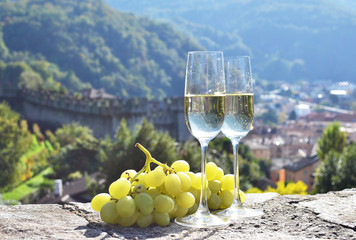 Pair of champagne glasses and grapes. Bellinzona, Switzerland - 145016235
