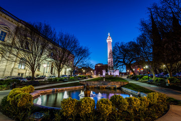 Reflection of the washington Monument from the pond in Mount Vernon Baltimore, Maryland at night