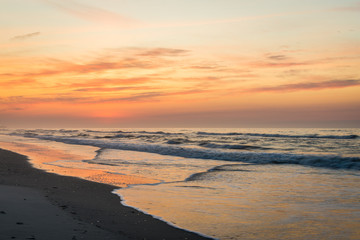 Fototapeta na wymiar Sandy Beach in ventnor city beach in atlantic city, new jersey at sunrise