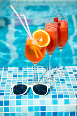 cocktail on the pool nosing at the tropical resort, 