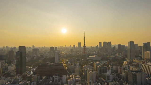 4k time lapse of sunset day to night at Tokyo city skyline, Tokyo Tower. Tilt down