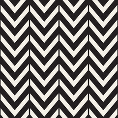 Seamless vector pattern. Abstract geometric lattice background. Rhythmic zigzag structure. Monochrome texture with chevron lines...