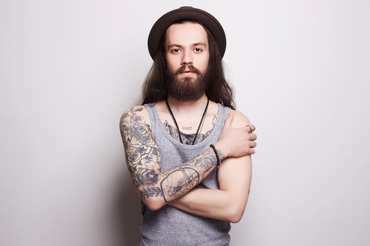 handsome bearded man in hat.tattoo.hipster