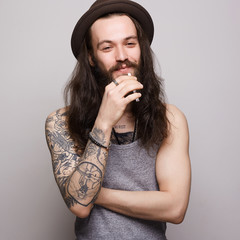 Smiling Hipster boy.handsome man in hat